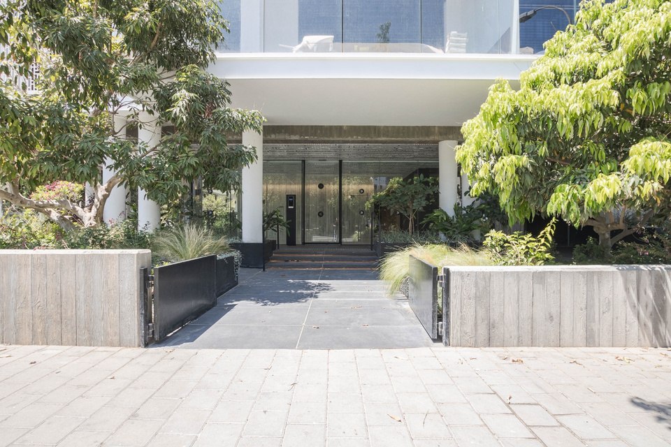Building entrance framed by trees